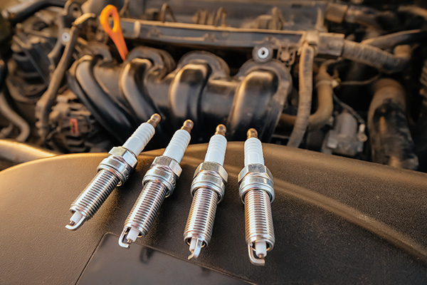 Why Do Worn Spark Plugs Become More Noticeable as Temperatures Drop?